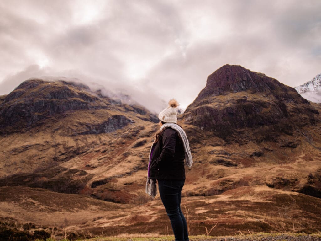 The Asheville Wedding photographer stands looking at the mountains.