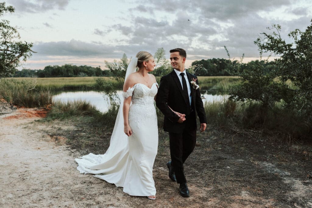 An eloping couple walks through a South Carolina Park.
